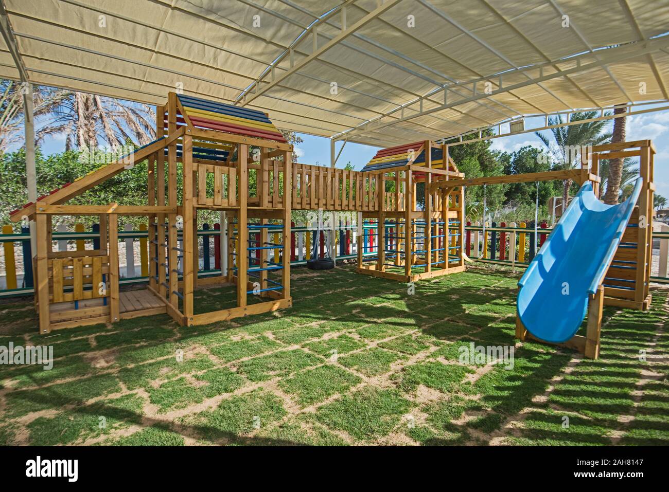 Large wooden climbing frame structure in children's playground area of luxury hotel Stock Photo