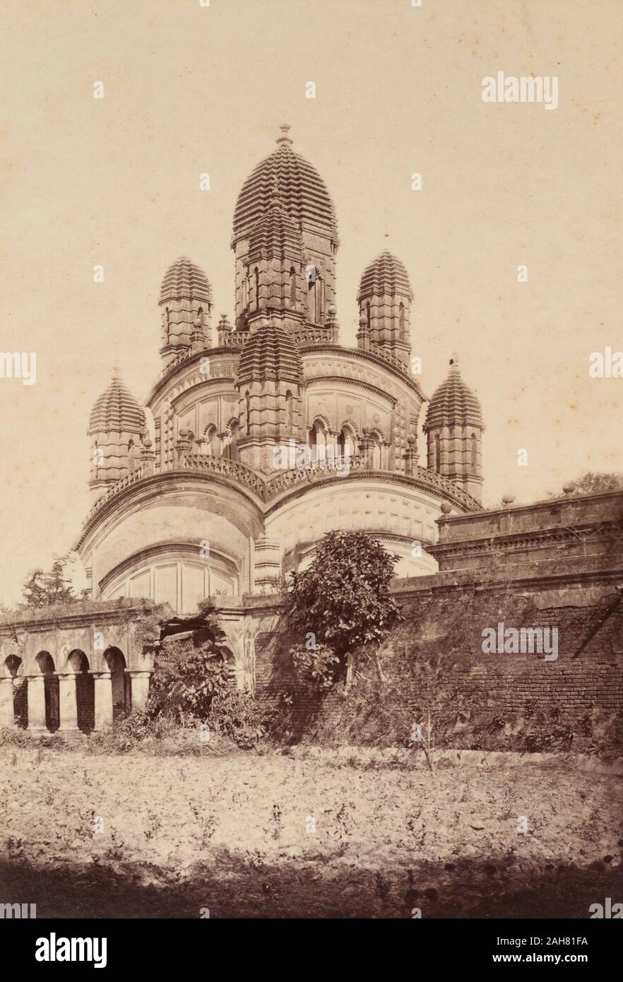 India, The Dakshineswar Kali temple in Kolkata, constructed 1847-1855 and adorned with nine 'chhatris' (cenotaphs), each capped with a beehive-shaped dome.Original manuscript caption: Temple at Kali Ghat, circa 1905. 2003/071/1/1/3/11. Stock Photo