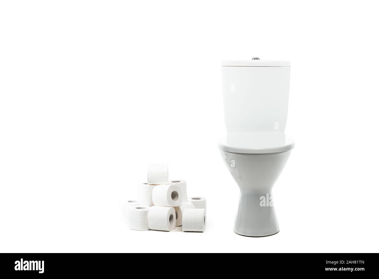 ceramic clean toilet bowl near rolls of toilet paper isolated on white ...