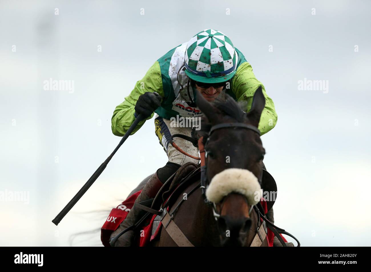 Clan Des Obeaux ridden by jockey Sam Twiston-Davies goes onto win the Ladbrokes King George VI Chase during day one of the Winter Festival at Kempton Park Racecourse. Stock Photo