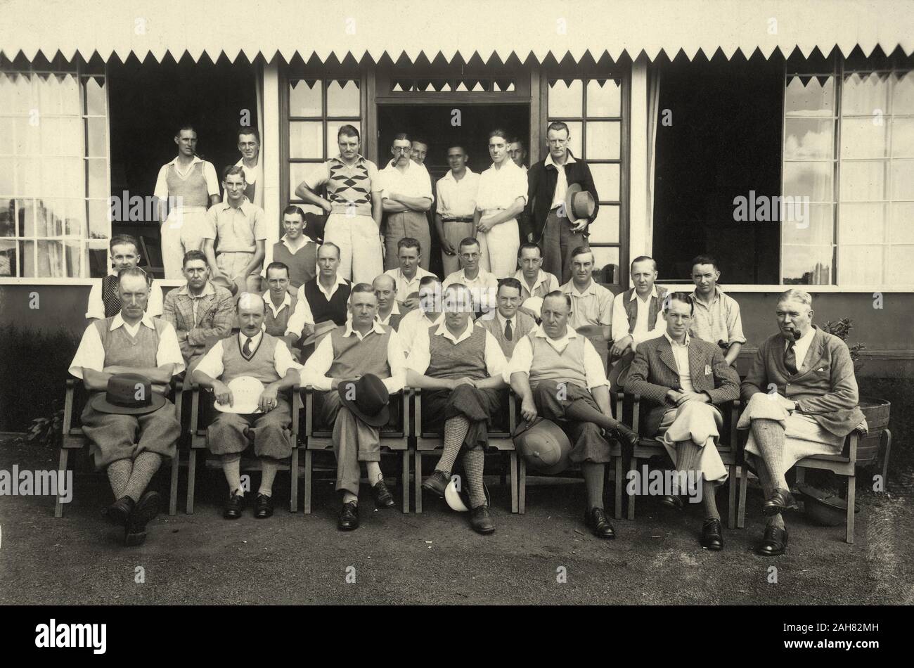 Kenya, Group photograph of European men in plus fours outside a sports pavilion. The occasion appears to be a match between the Muthaiga and Railway Golf Clubs, and Parlane Macfarlane is seated in the front row.Original manuscript caption: Muthaiga & Rly14/5/33Stamped copyright notice: PHOTO By EAST AFRICAN STANDARD Ltd. NAIROBI, 14 May 1933. 1999/135/1/1/24. Stock Photo