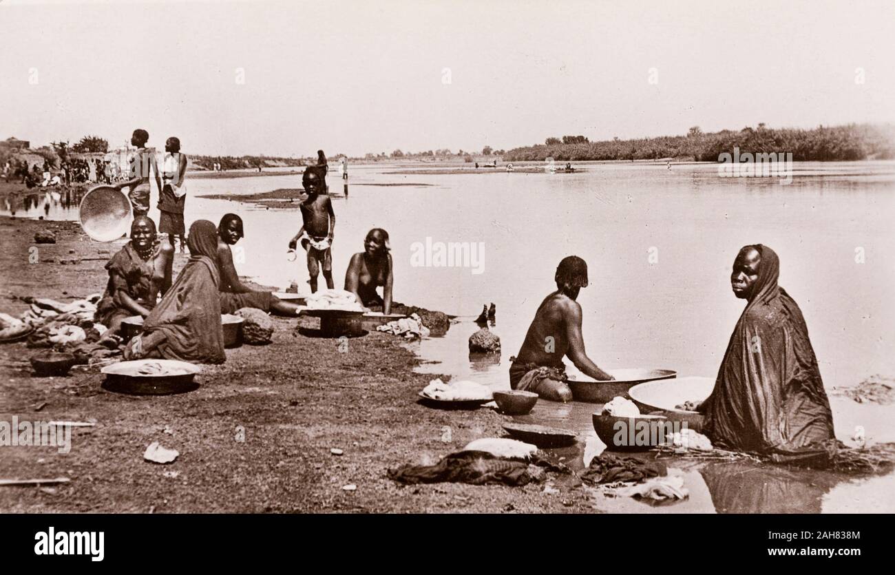 Sudan, Printed caption reads: 'Washing Day at Wau, Bahr-El-Ghazal. Published by G N Morhig, The English Pharmacy, Khartoum. Copyright 62', [c.1906]. 2003/222/1/2/61. Stock Photo