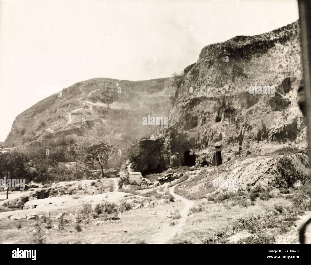 China, A number of cave dwellings, built into a cliff face on the banks of the Yellow River. Original manuscript caption: Cave dwellings on banks of Yellow River Central China, [1909]. 1998/028/1/1/191. Stock Photo