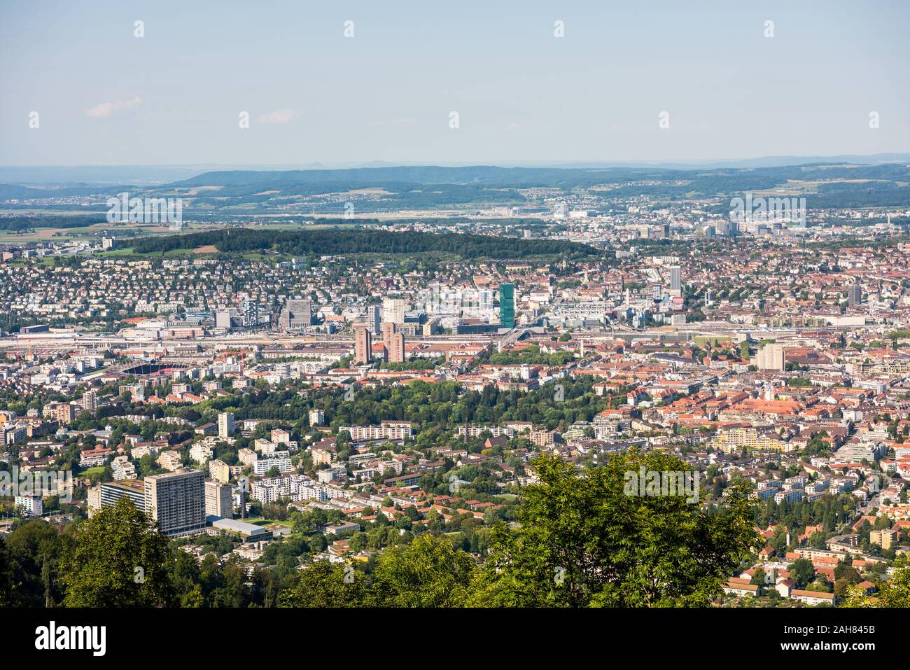 Panoramaof old downtown of Zurich city, with beautiful house at the bank of Limmat River, aerial view from the top of Mount Uetliberg Stock Photo