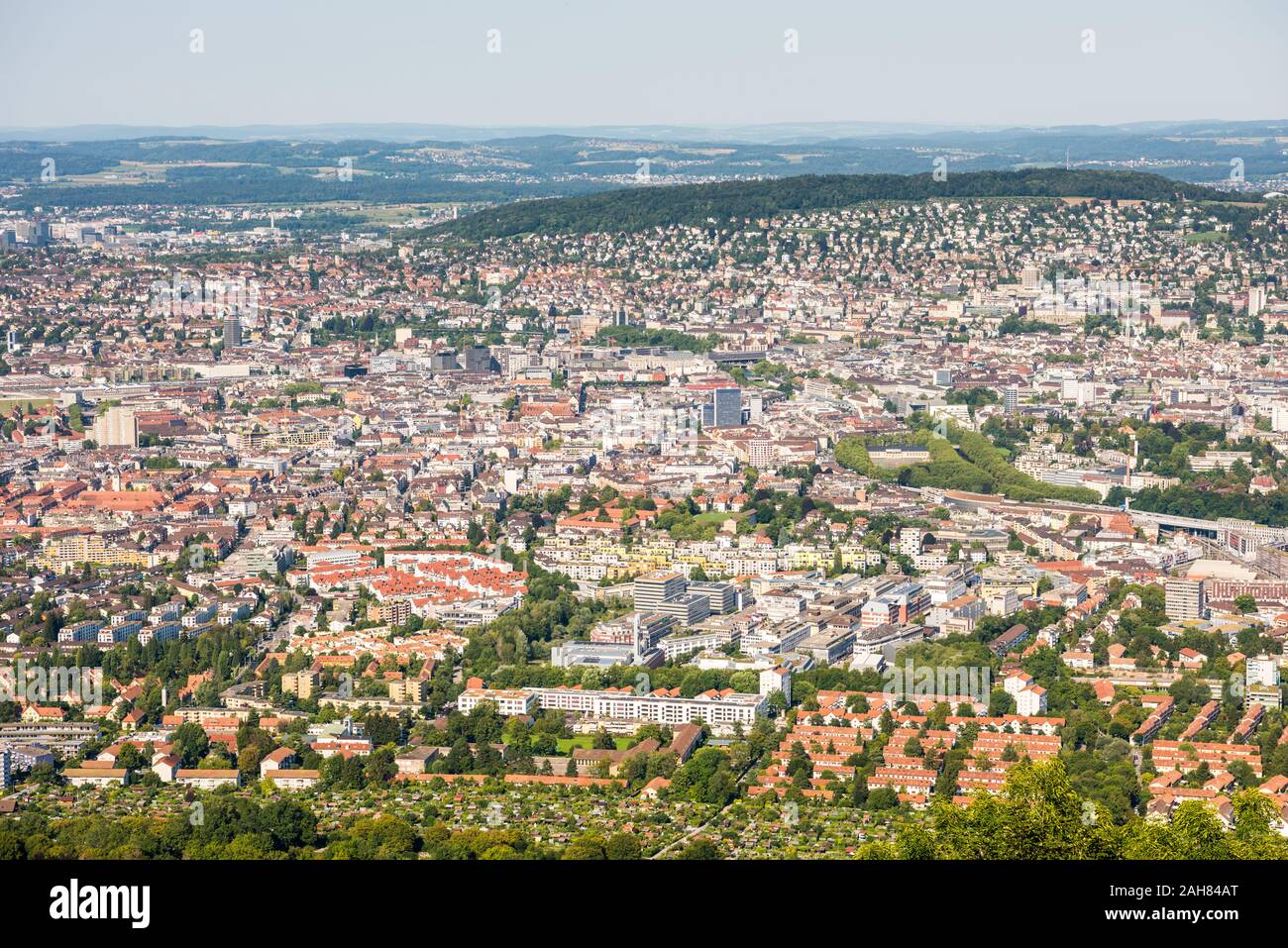 Panoramaof old downtown of Zurich city, with beautiful house at the bank of Limmat River, aerial view from the top of Mount Uetliberg Stock Photo