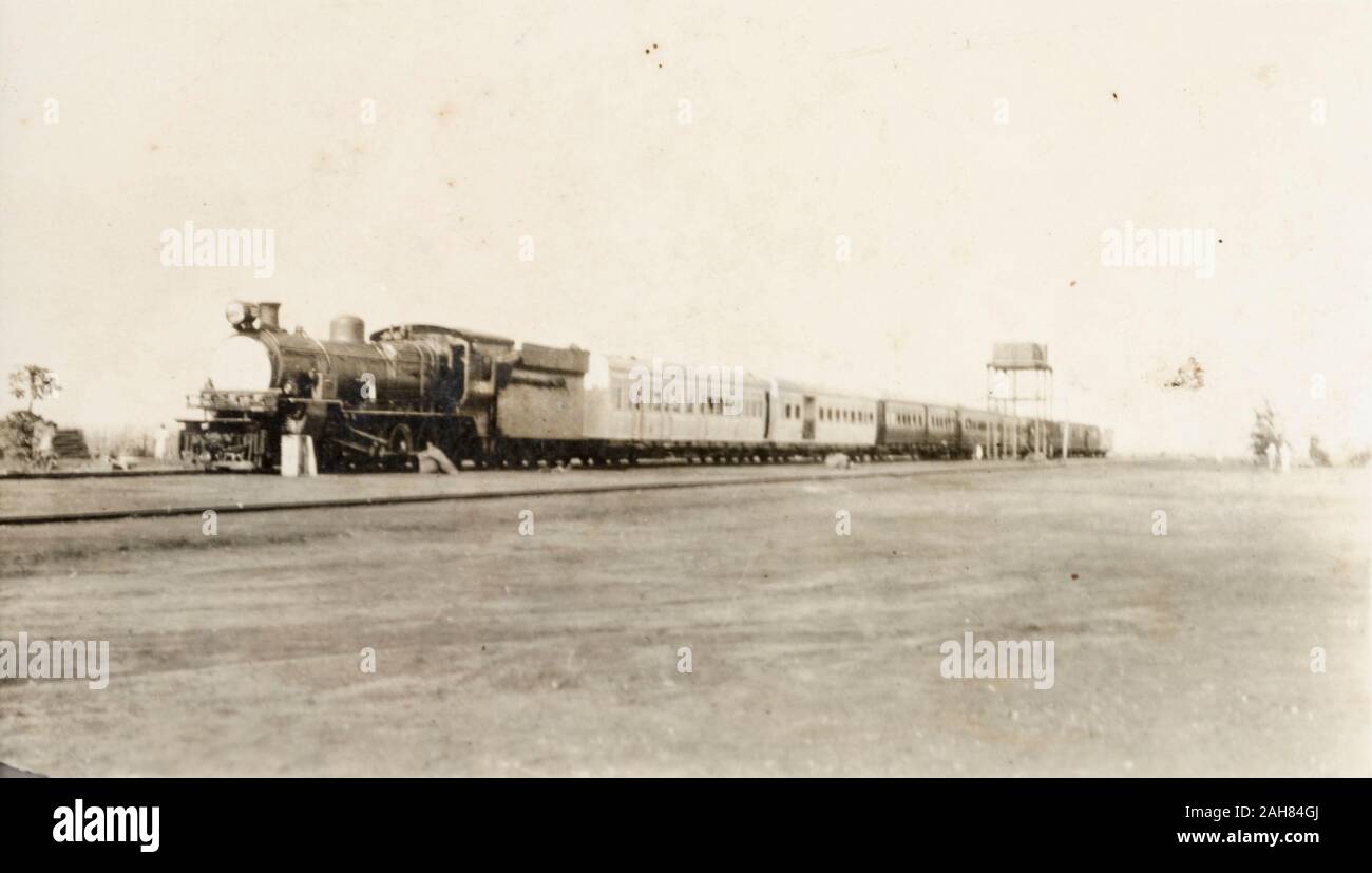 KenyaUganda, Uganda Railways steam train travelling along the Mombasa to Kisumu railway line. This image is believed to have been removed from the Blixen album.EH manuscript caption: The old Uganda railway, Mombasa-Kisumu (completed 1900), circa 1927. 1995/076/1/2/6/14. Stock Photo
