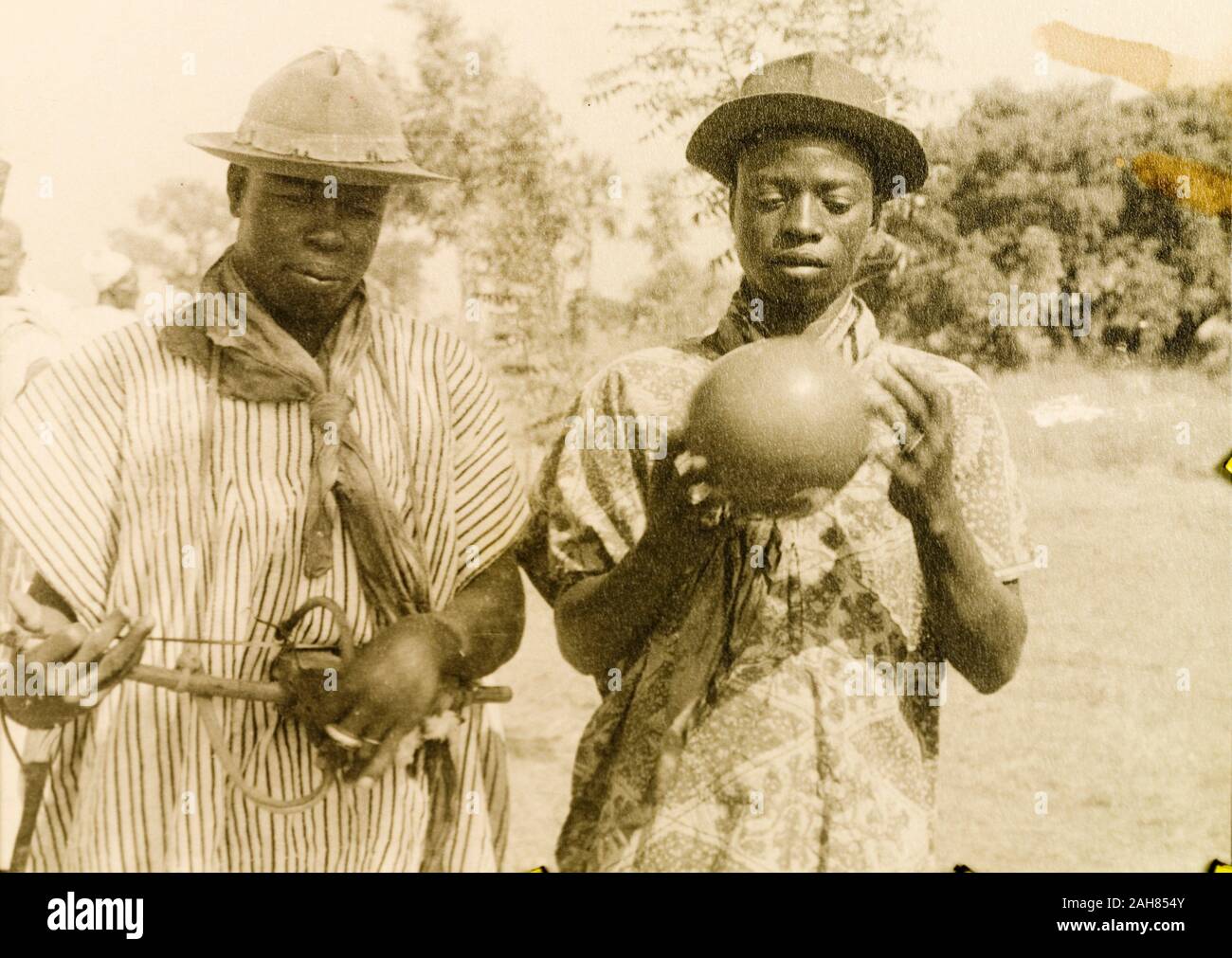 Gold CoastGhana, Two men play traditional West African string and ...