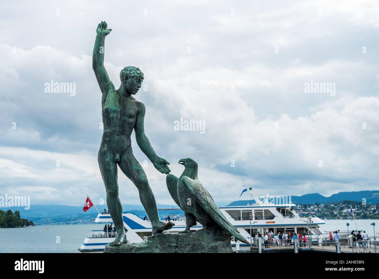Ganymede Statue of a man and an eagle in Zurich Switzerland - Lake Zurich Stock Photo