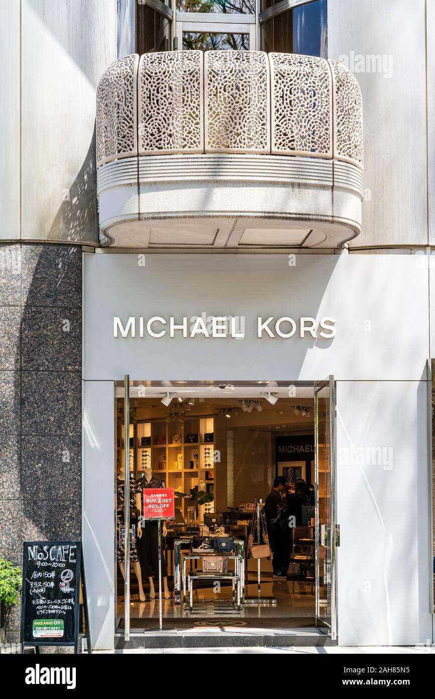 Michael Kors store in Shibuya, Tokyo. Close up of ground floor entrance  looking into the shop with women's handbags on sale with red sale sign  Stock Photo - Alamy