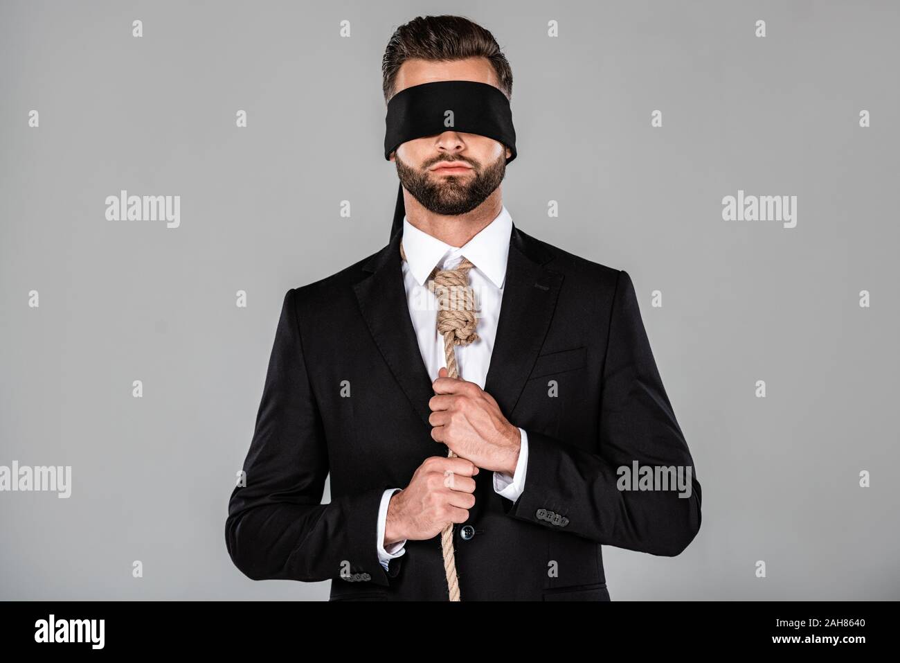 Young Woman Wearing Black Blindfold Isolated On Grey Stock Photo