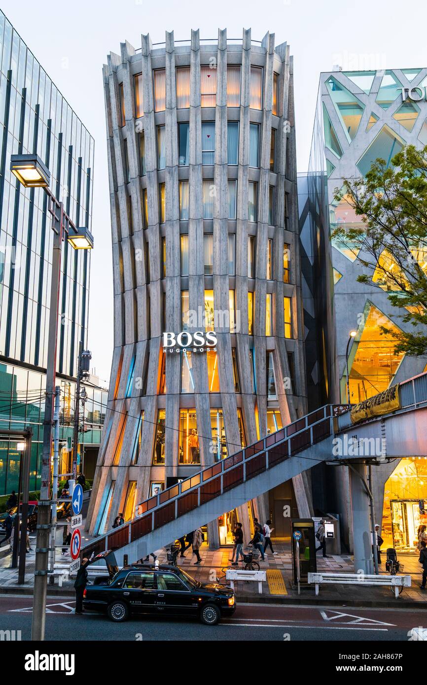 Hugo Boss flagship store in Omotesando, Tokyo. Designer Norihiko Dan.  Multiple leaf-shaped columns made from reinforced concrete. Blue hour,  evening Stock Photo - Alamy