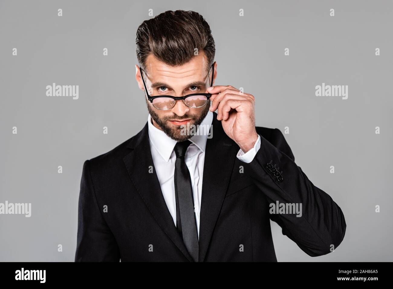 confident successful businessman in black suit and glasses isolated on ...