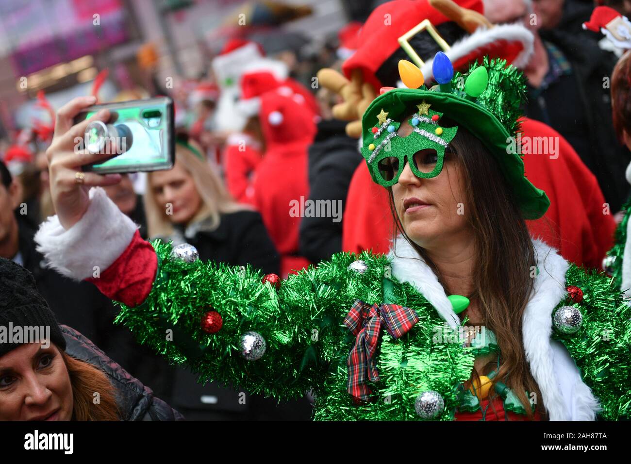 Hundreds of people participate in SantaCon NY, an annual pub crawl in which people dressed in Santa Claus costumes or as other Christmas characters pa Stock Photo