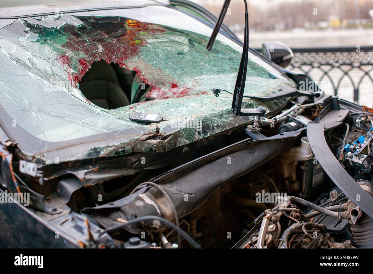 Broken car windshield after an accident with traces of blood and airbag. Stock Photo