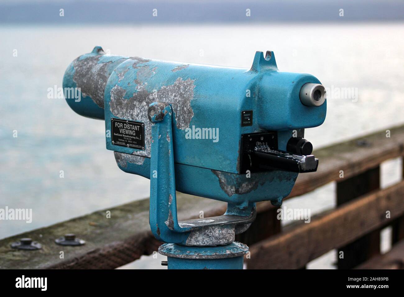 Weathered coin-operated sight viewer telescope - for distant viewing - at observation point Stock Photo