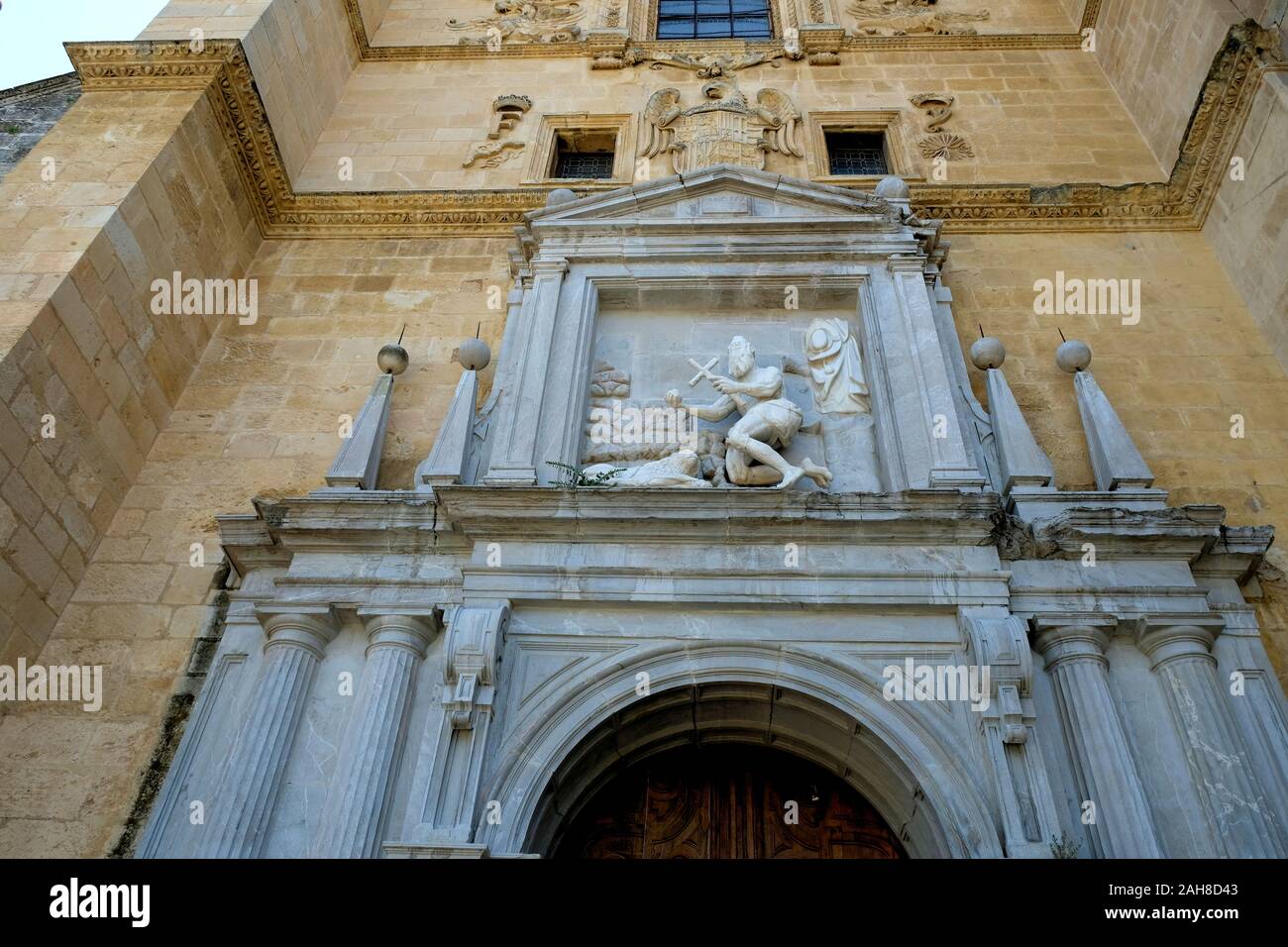 Sculpted depiction of St. Jerome on the exterior wall above the chapel's doorway at the Real Monasterio de San Jerónimo de Granada in Granada, Spain. Stock Photo