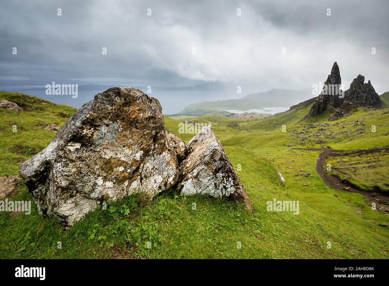 Wide angle view of the iconic scottish Old Man of Storr under a dark cloudy sky Stock Photo