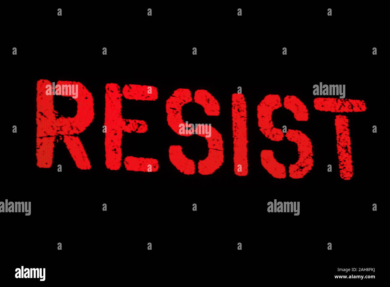 red inscription resist protest on a black background Stock Photo