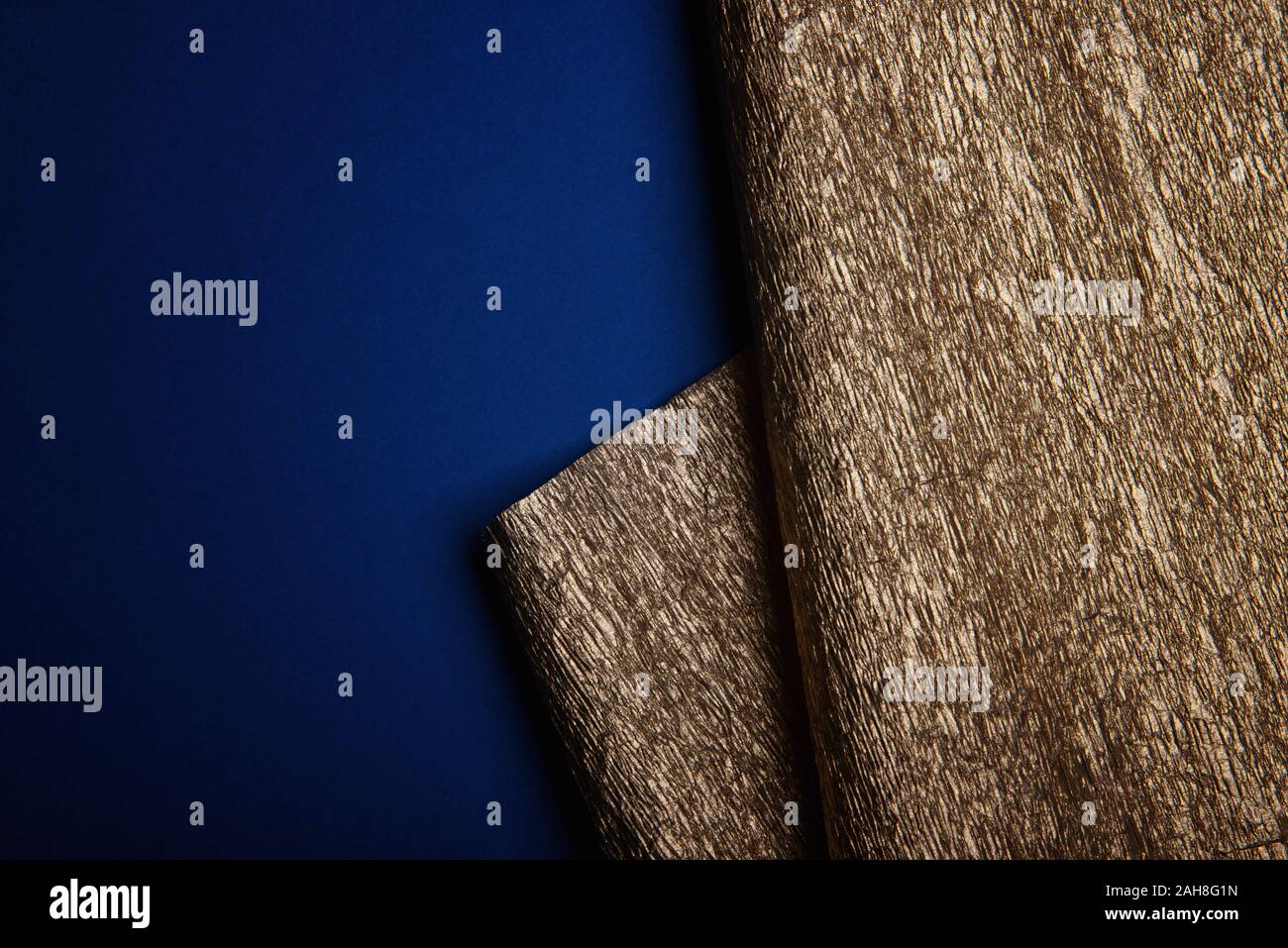 Golden texture. Gold leaf corrugated wrapping paper. Stock Photo