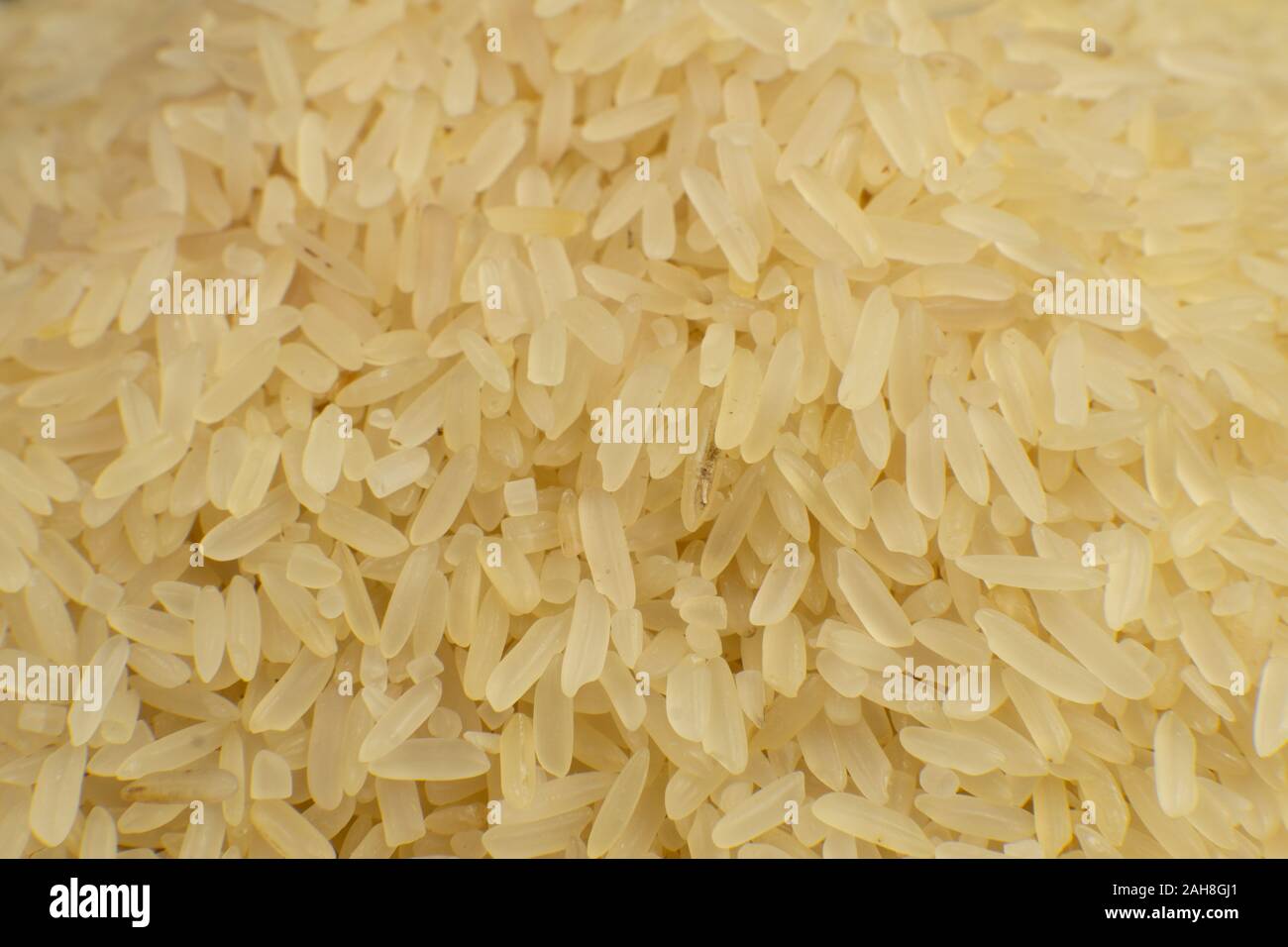 Long grain white rice background. Macro, closeup. Rice texture. Top view. Stock Photo