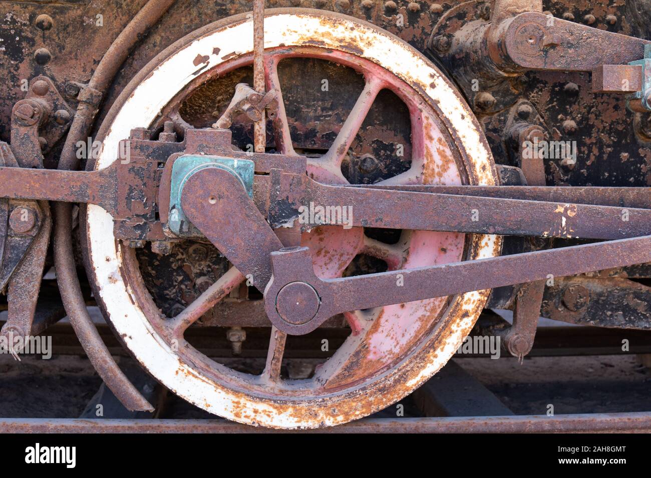 The wheel from an Old Steam Train at the abandoned Humberstone Saltpeter factory in the Atacama Desert, Northern Chile Stock Photo