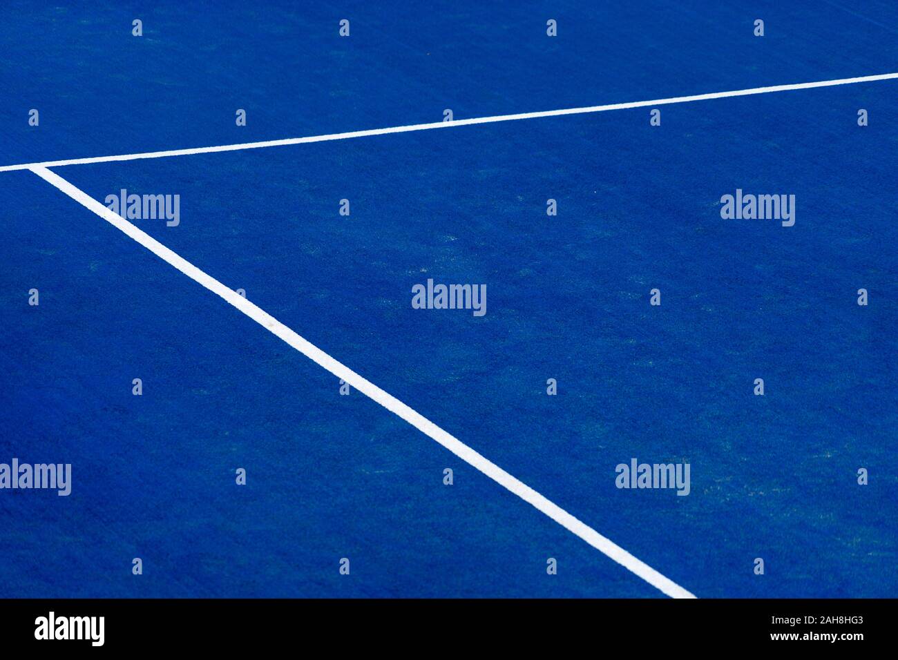 Blue paddle tennis court field with white lines background Stock Photo