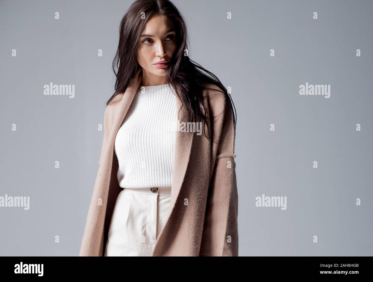 Klara Korobova models fashion for Winter 2020 in studio fashion shoot. Stock Photo
