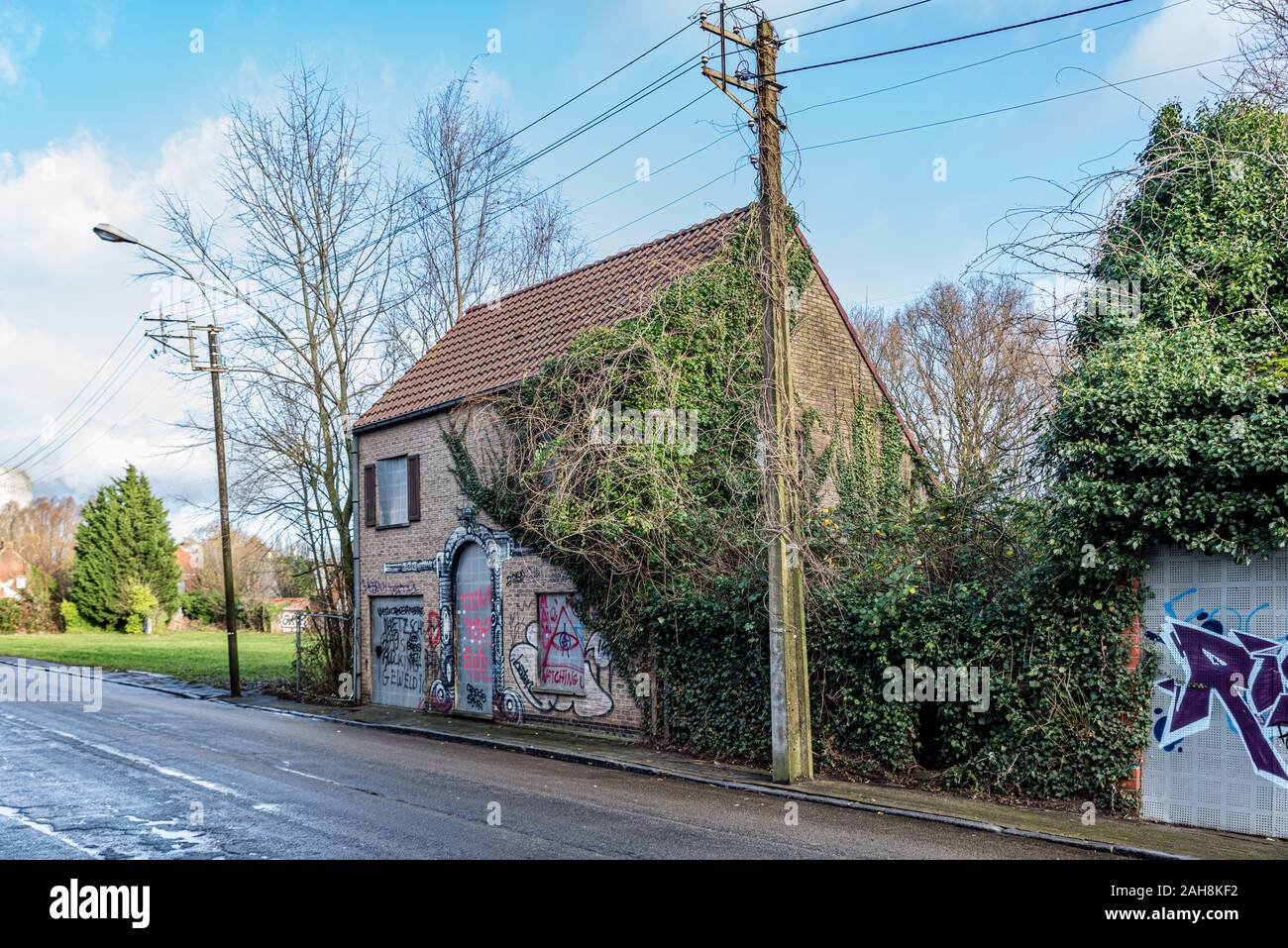 Doel Belgium December 24 2019 Abandoned village Doel in Belgium as a ghost town taken over by grafity street art near the the nuclear power plant Stock Photo