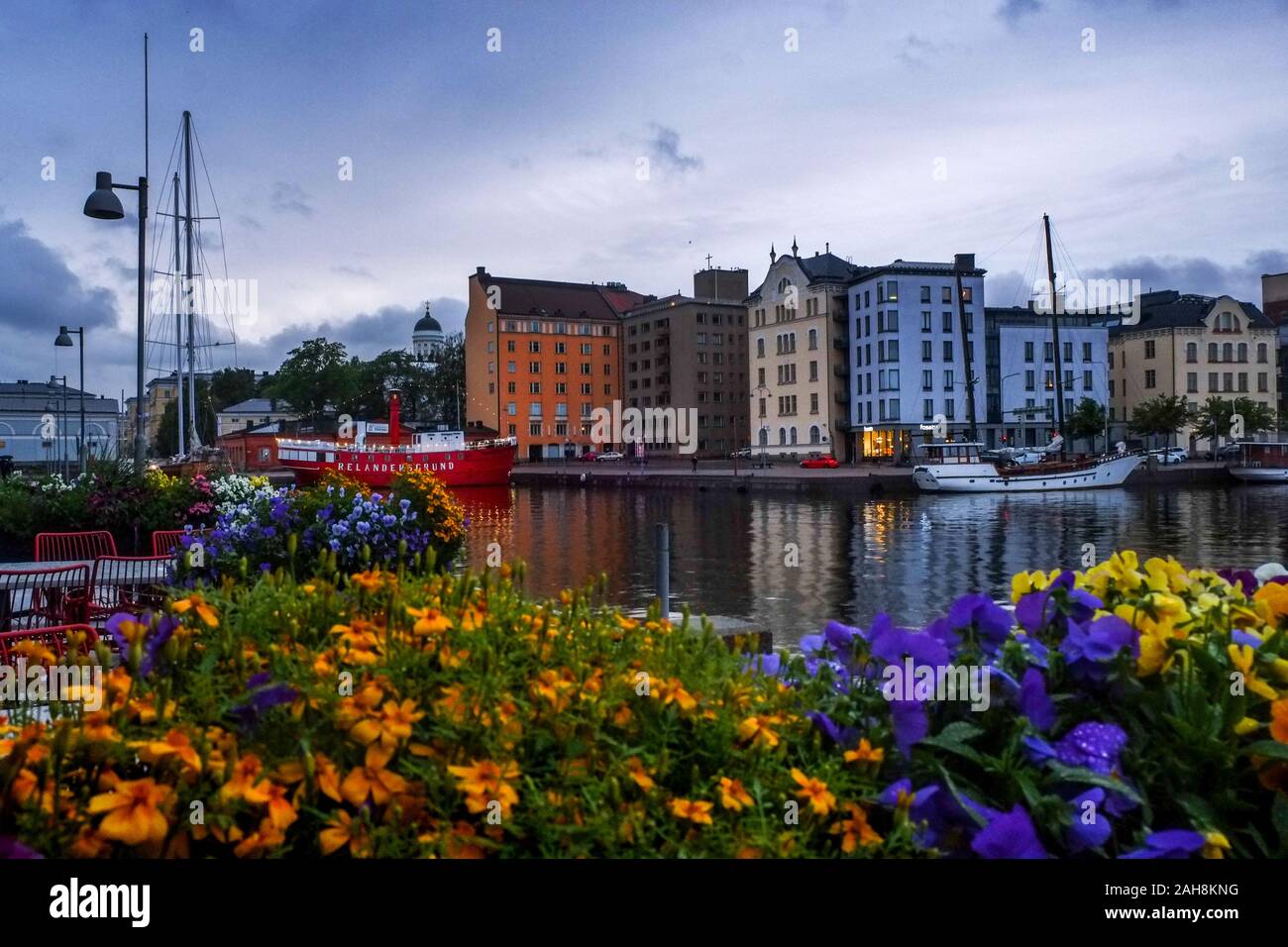 Colorful flowers and boats in the harbor of Helsinki, Finland Stock Photo