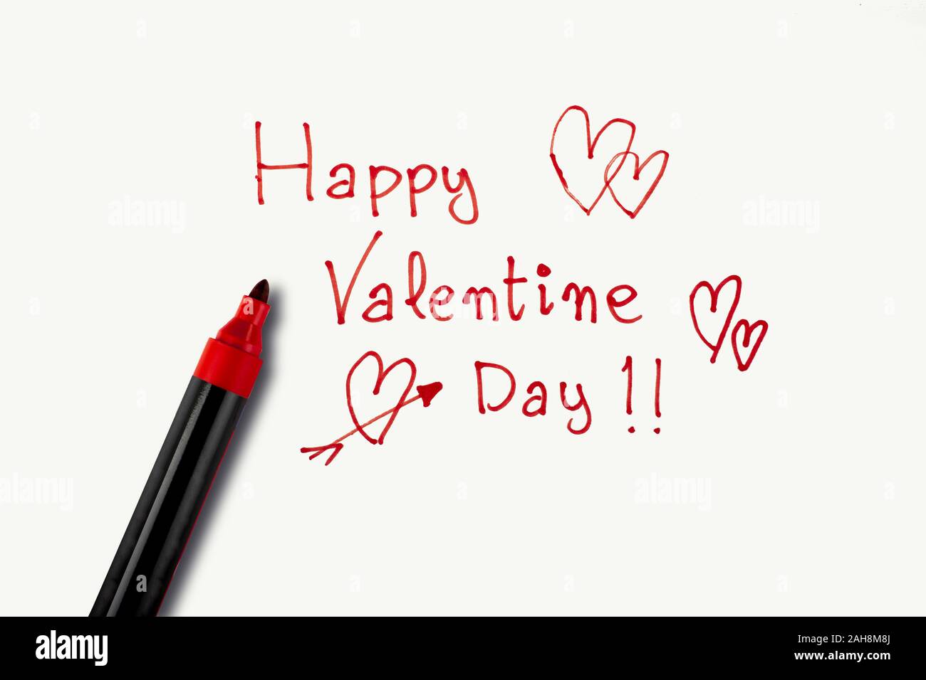 Valentine's Day phrase made with a red marker on a white background. Concept of St. Valentine's Day Stock Photo