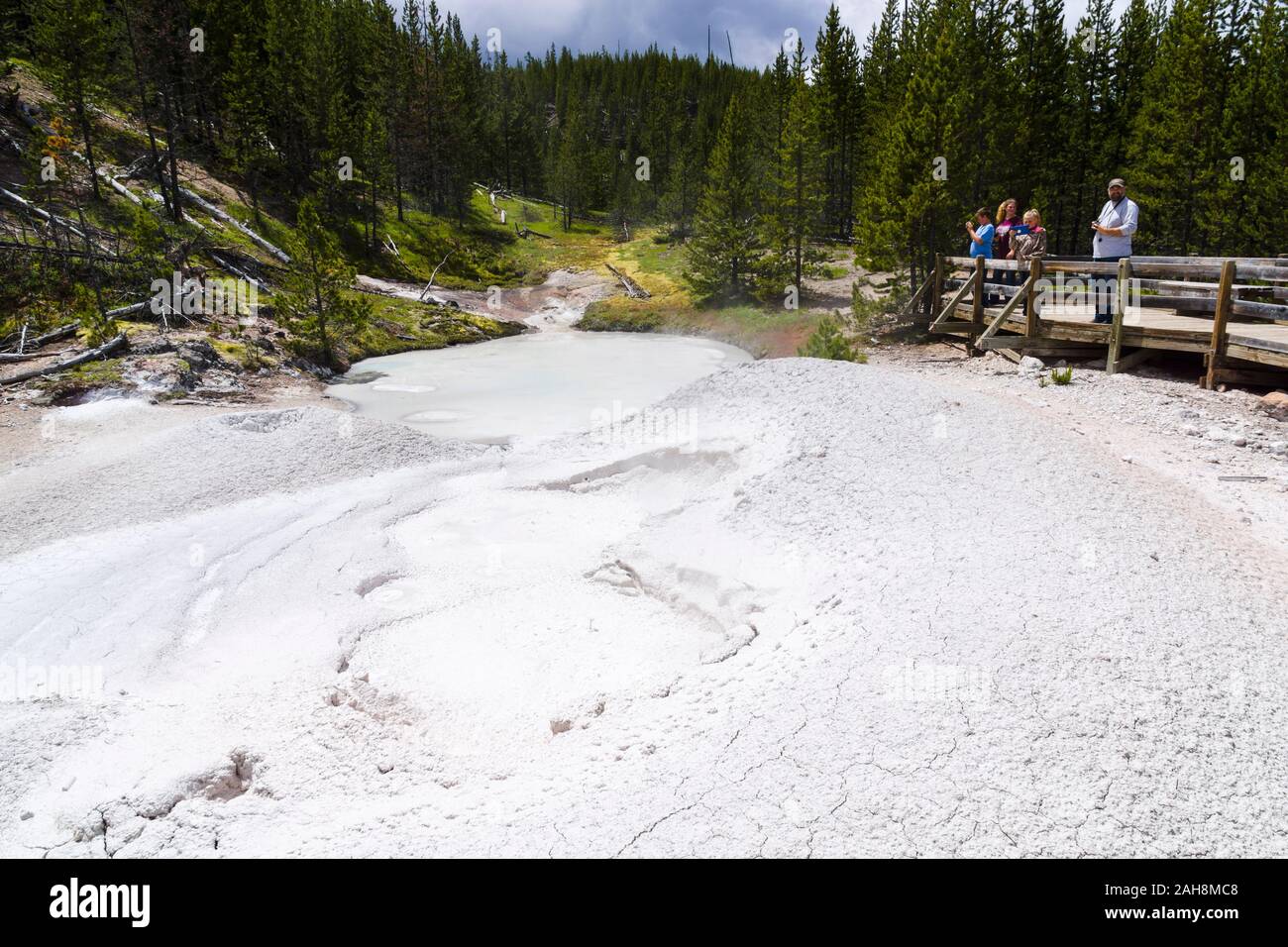 Tourists watching mud port at Artist Paint Pots, Yellowstone National Park, Wyoming, United States Stock Photo