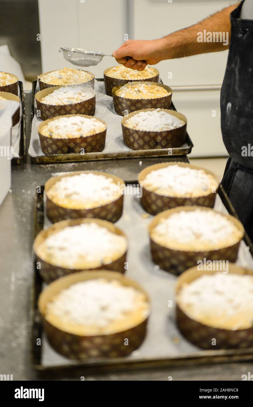 Adult strong man baking milanese traditional is an Italian