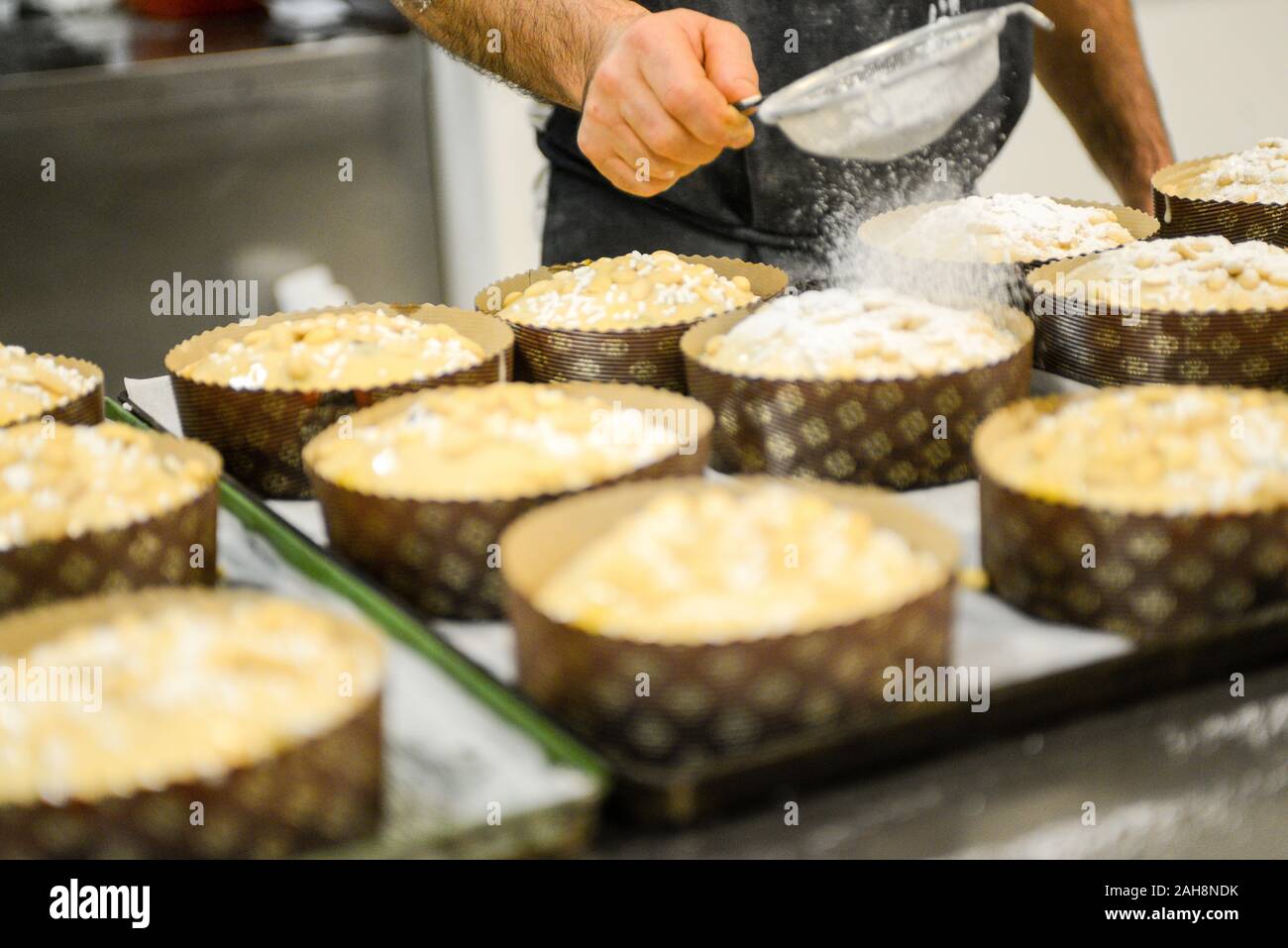Adult strong man baking milanese traditional is an Italian