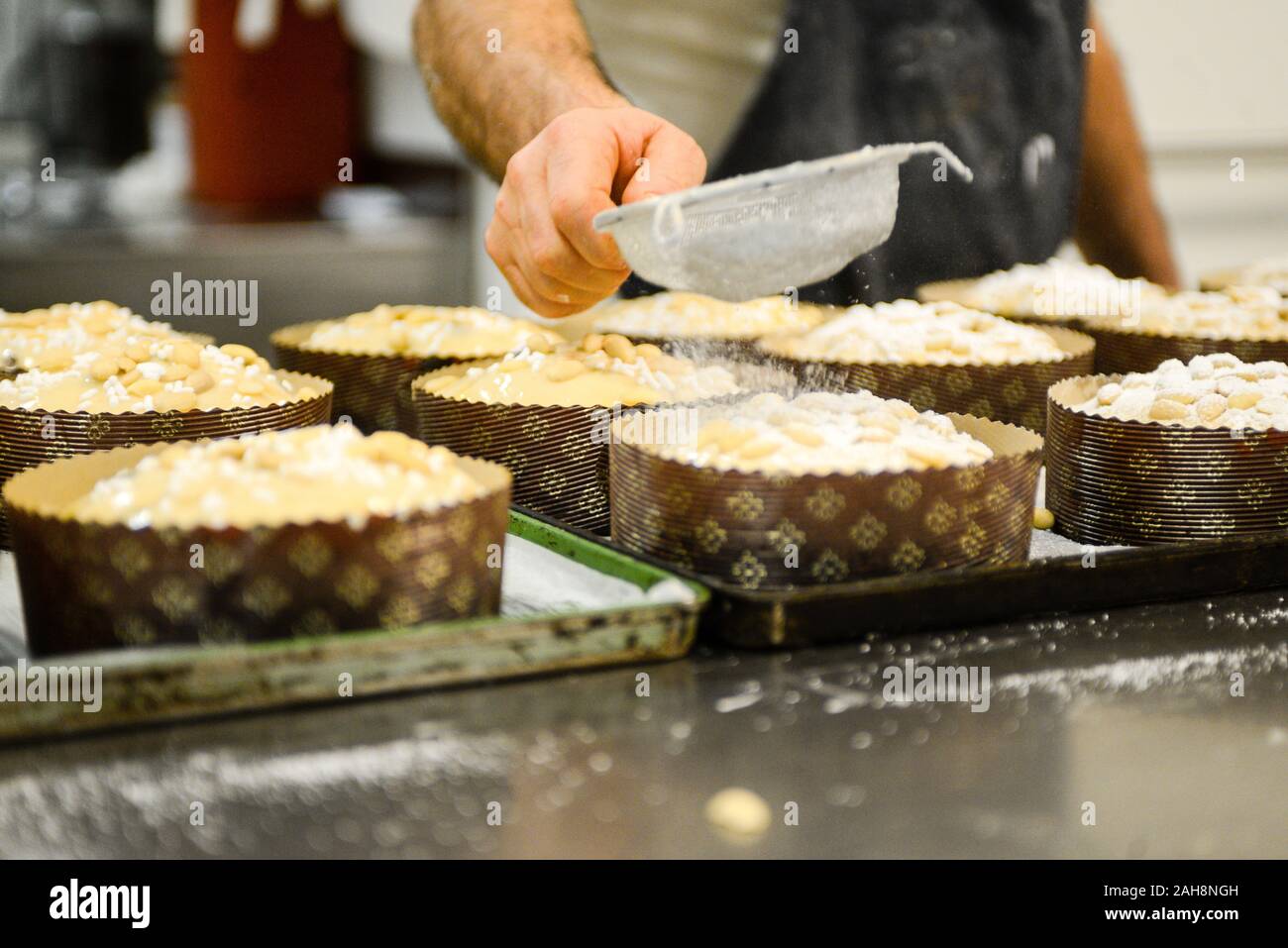 Adult strong man baking milanese traditional is an Italian