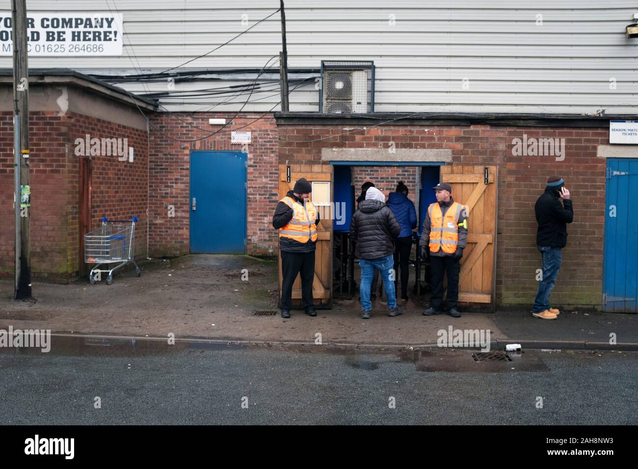 Spectators entering the ground before Macclesfield Town played Grimsby Town in a SkyBet League 2 fixture at Moss Rose. The home club had suffered problems in the run up to this fixture with the EFL deducting points after they failed to pay staff and they had a game postponed. This match ended in a 1-1 draw, watched by a crowd of 1,991. Stock Photo