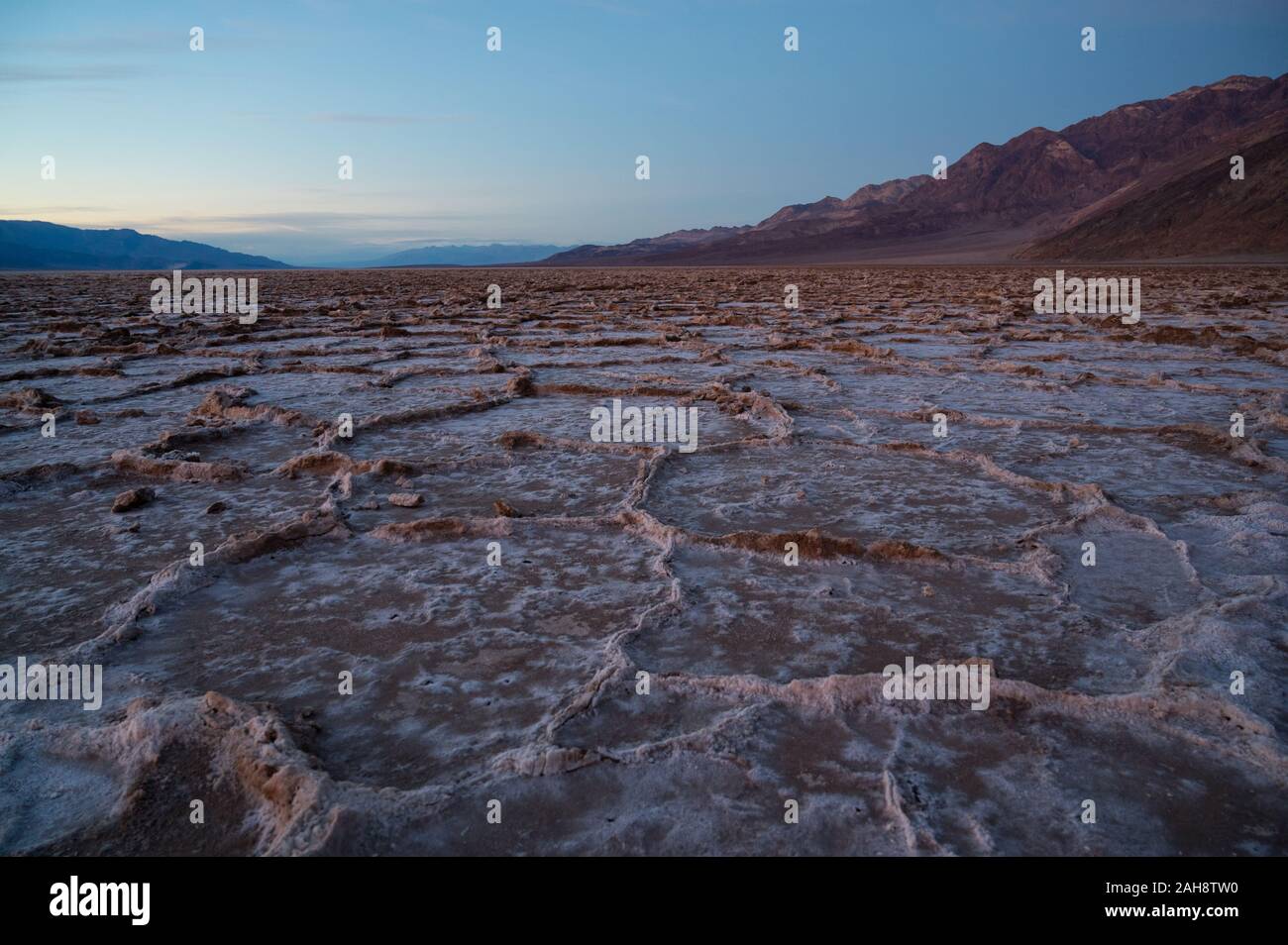 Sunset over Badwater Basin in the Death Valley National Park with in ...