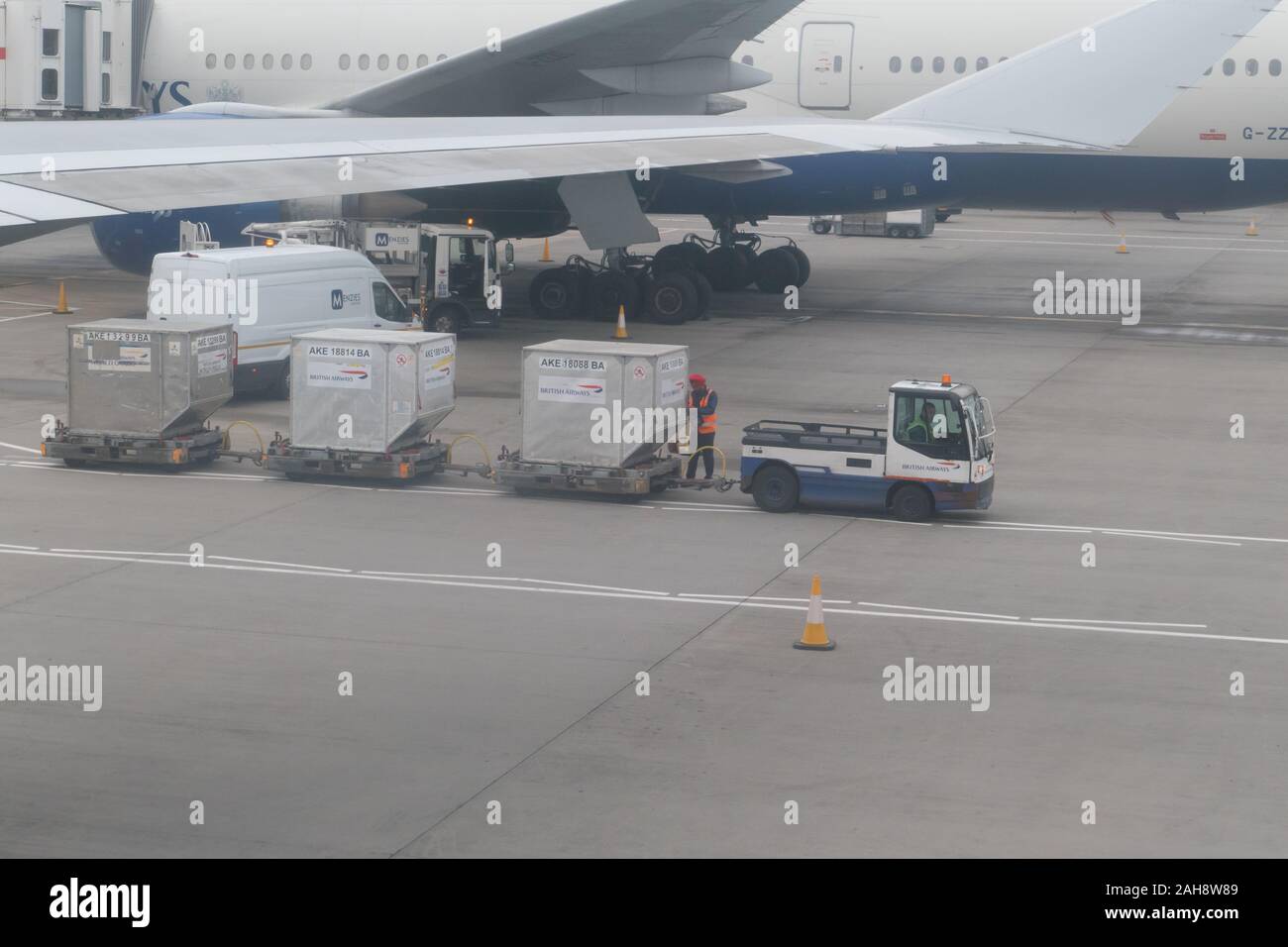 British Airways bagage handlers on the tarmac in Heathrow Stock Photo