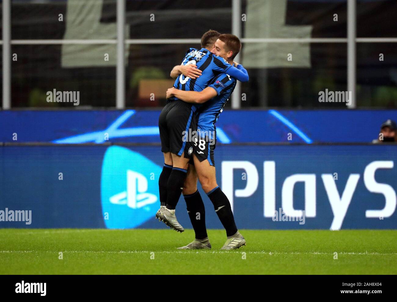 MILAN, ITALY - November 6, 2019:  Mario Pasalic celebrates with Alejandro Gomez after scoring the goal of 1-1 during the UEFA Champions League 2019/20 Stock Photo