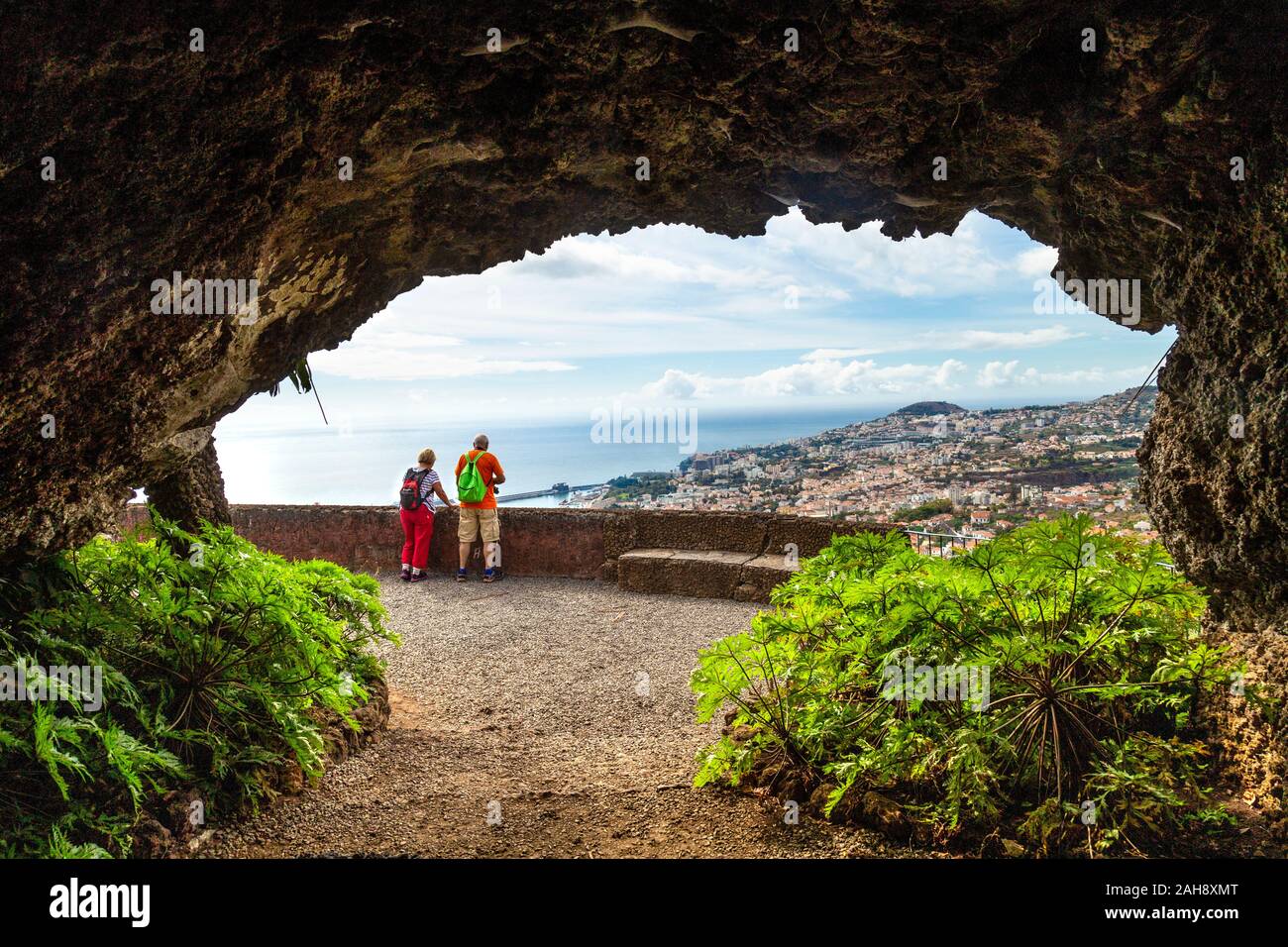 Tourists looking over Funchal city from the Botanical Gardens (Jardim Botânico da Madeira), Madeira, Portugal Stock Photo