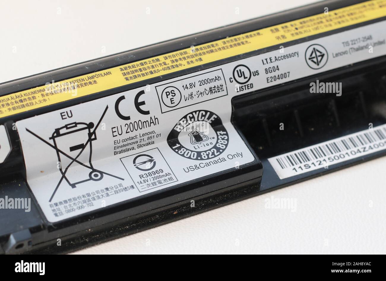 Lenovo laptop battery with disposal instructions. Stock Photo