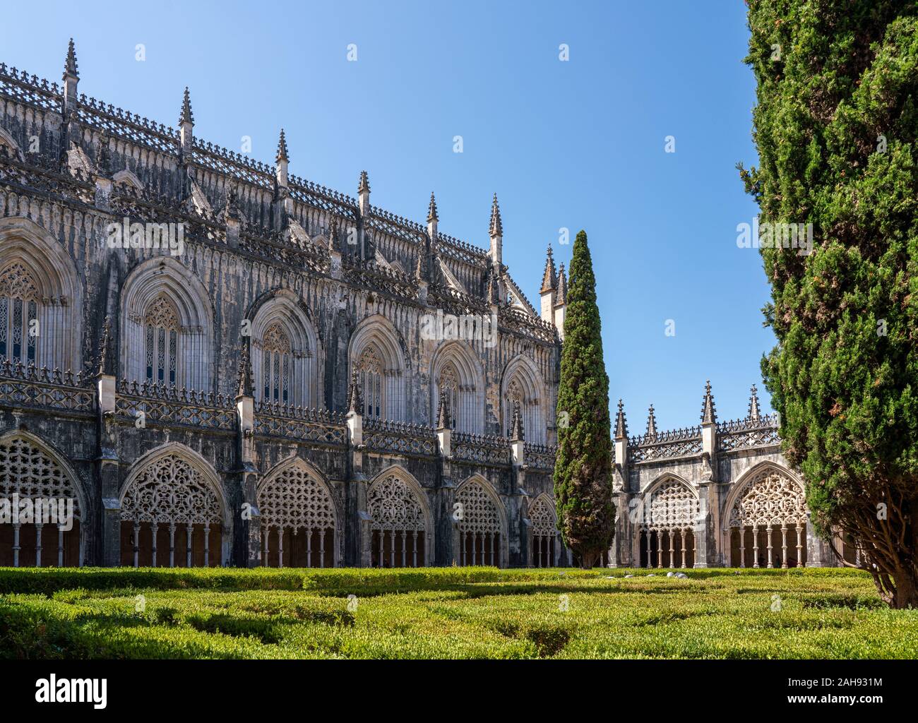 Ornate arches around the cloisters at the Batalha Monastery near Leiria in Portugal Stock Photo