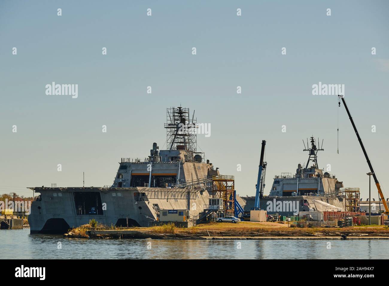 US Navy littoral ships being built in the Austal ship building yard  on the Mobile River in Mobile bay, Mobile Alabama. Stock Photo