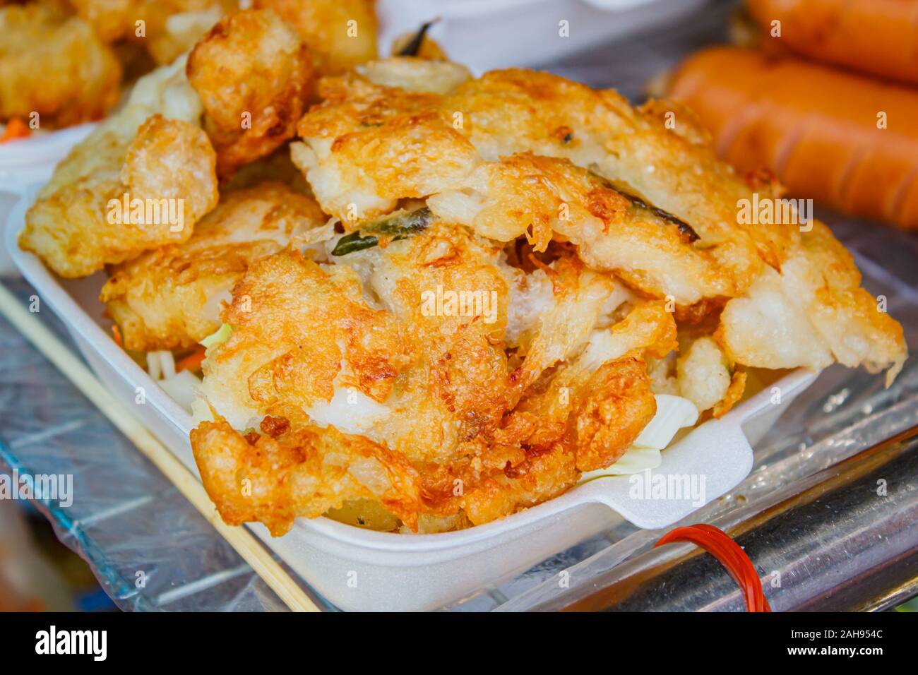 Fried squid at market street food in Bangkok Stock Photo - Alamy