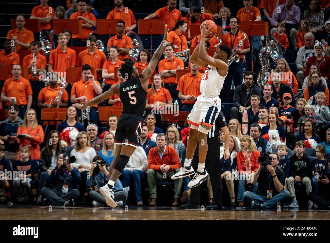Charlottesville, VA, USA. 22nd Dec, 2019. Virginia Guard Casey Morsell (13) shoots over South Carolina Guard Jermaine Couisnard (5) during the NCAA Basketball game between the University of South Carolina Gamecocks and University of Virginia Cavaliers at John Paul Jones Arena in Charlottesville, VA. Brian McWaltersCSM/Alamy Live News Stock Photo