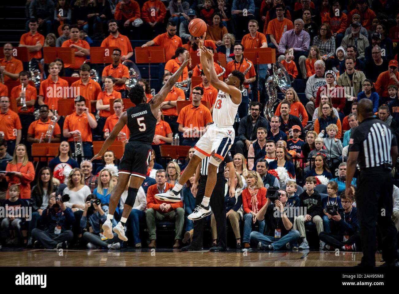 Charlottesville, VA, USA. 22nd Dec, 2019. Virginia Guard Casey Morsell (13) shoots over South Carolina Guard Jermaine Couisnard (5) during the NCAA Basketball game between the University of South Carolina Gamecocks and University of Virginia Cavaliers at John Paul Jones Arena in Charlottesville, VA. Brian McWaltersCSM/Alamy Live News Stock Photo