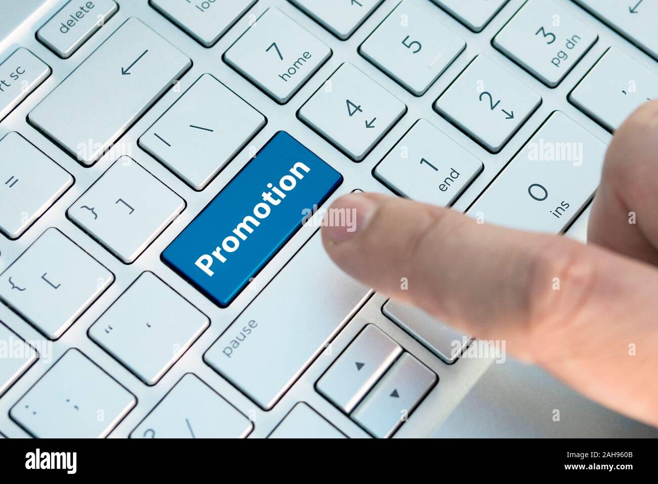 Computer notebook keyboard with promotion key - technology background. Stock Photo