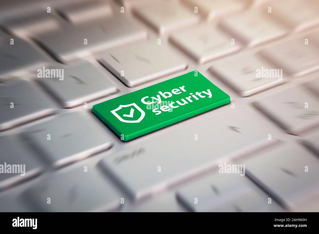 cyber security green button on the keyboard. Stock Photo
