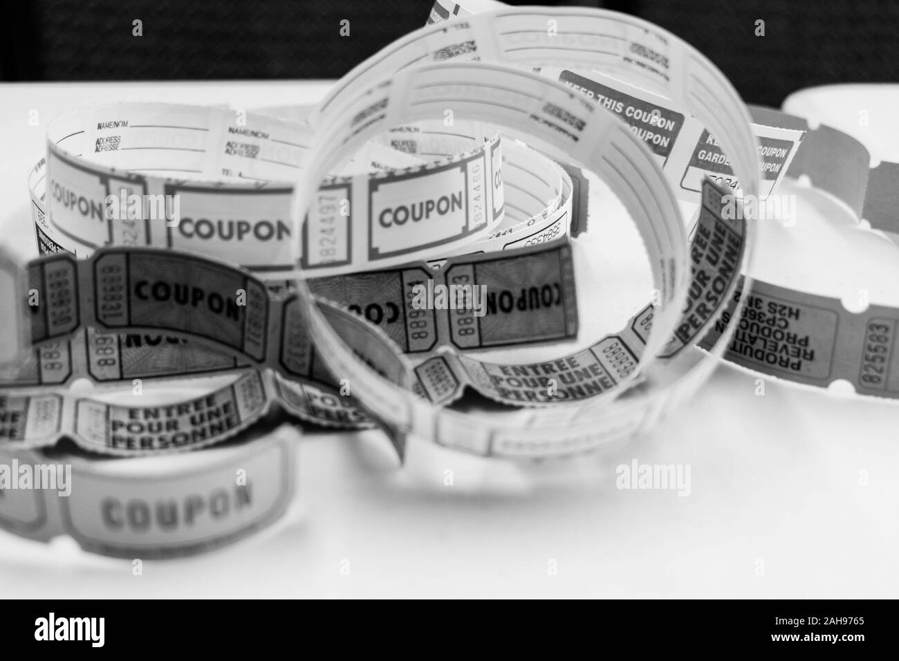 Black and white photo of unrolled raffle tickets Stock Photo