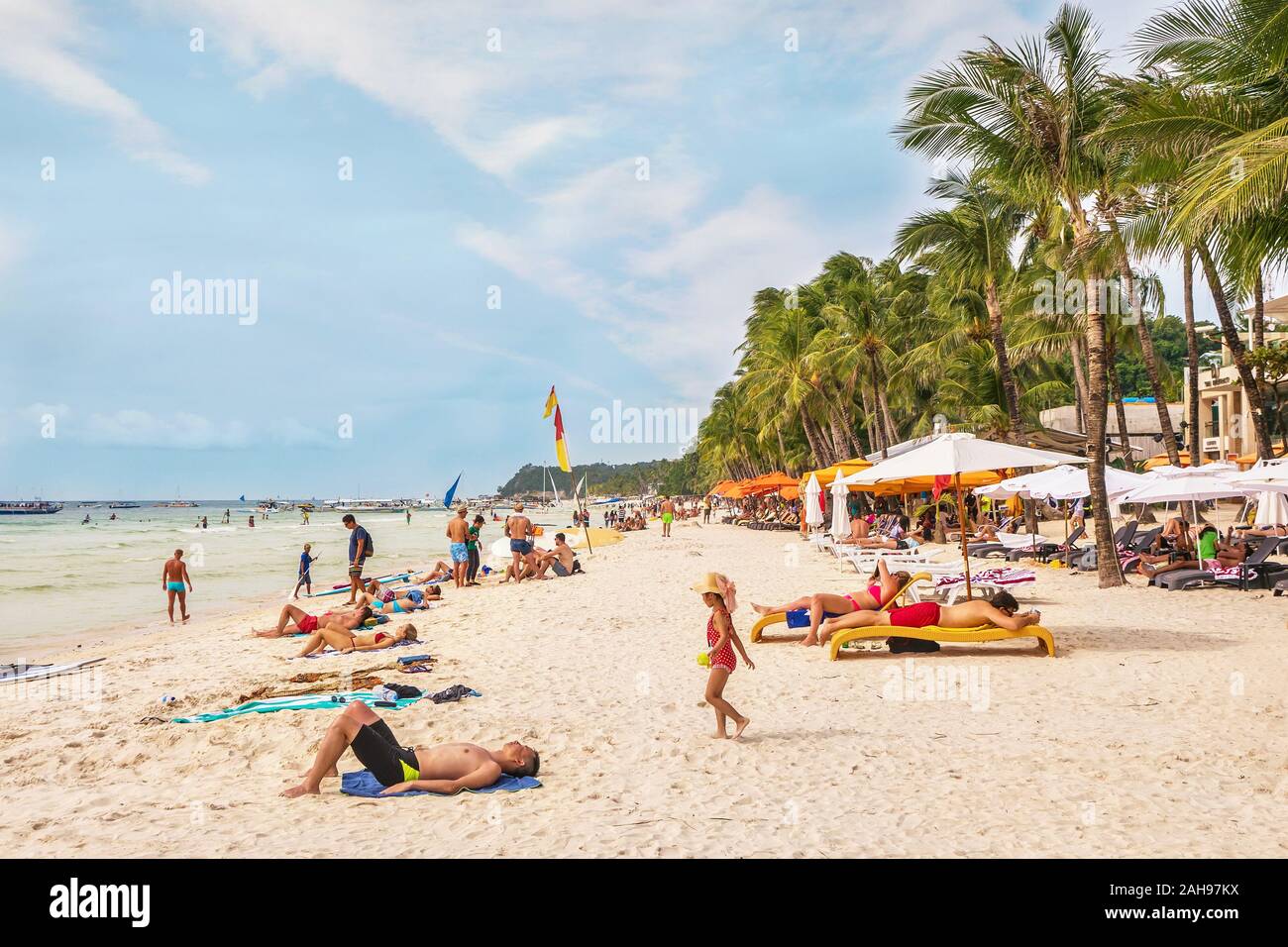 Boracay Island, Philippines - January 6, 2017. Tourists enjoying White Beach, Boracay in good weather. Stock Photo