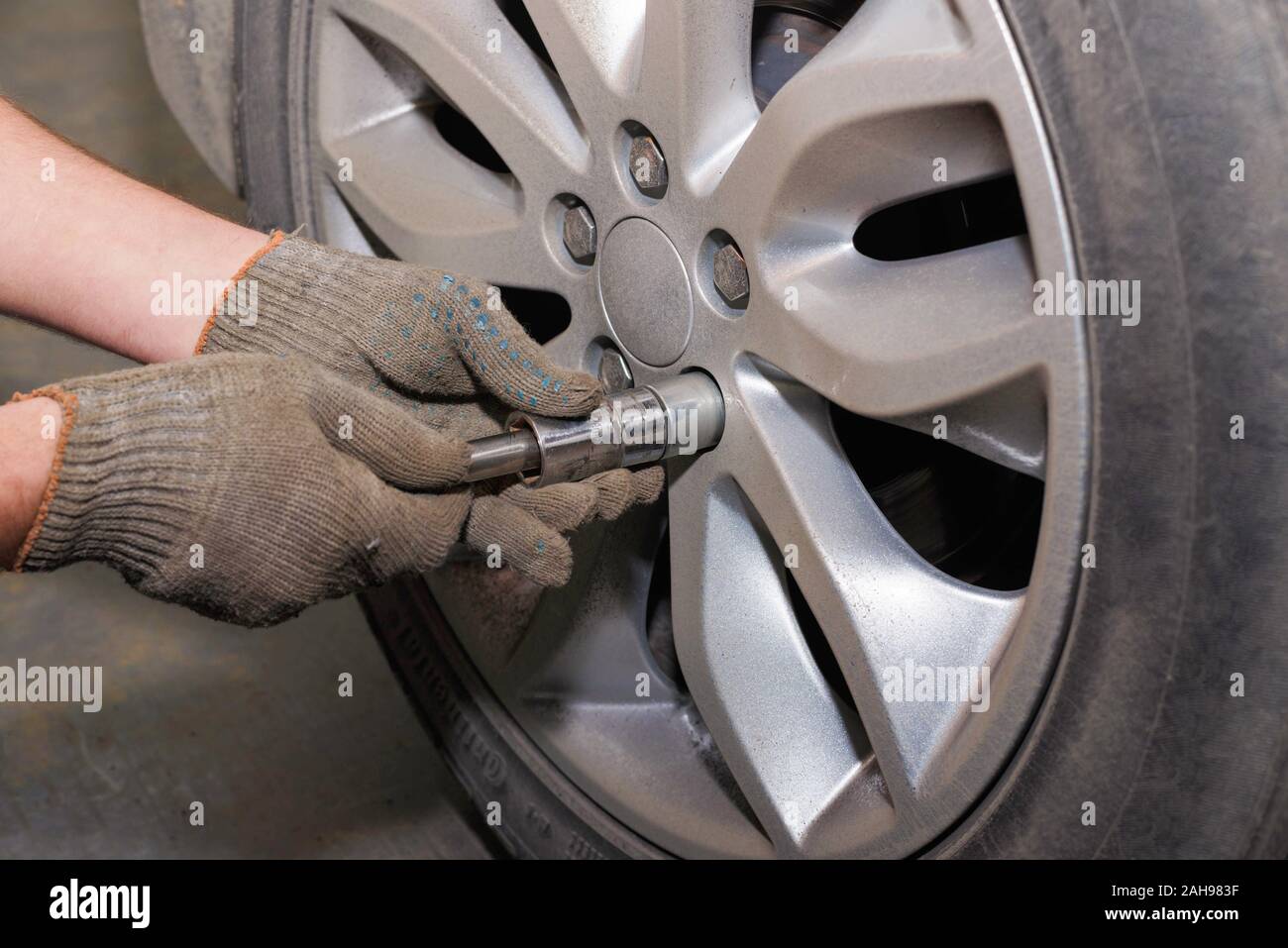 The process of changing tires on a car before the season. The process
